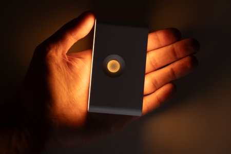 small solar night led light with motion sensor in the handの写真素材