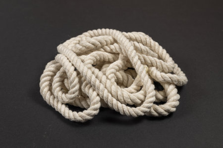 beige rope on dark background close up.の写真素材