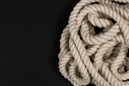 Rope detail on dark. Close-up of its rope texture Depth of field minimalism ropes.の写真素材