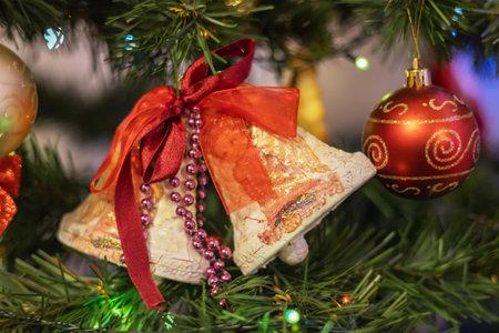 Christmas tree decorated with blue toys and golden garlandの写真素材