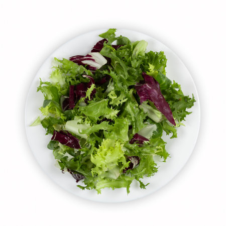 Mix salad in a plate with water drops on a white background. Top viewの写真素材