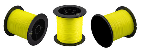 Fishing braided line in roll isolated on white background. Spool of green cord isolated. Spool of braided fishing line.の写真素材