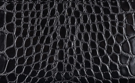 Black crocodile Leather background and texture.