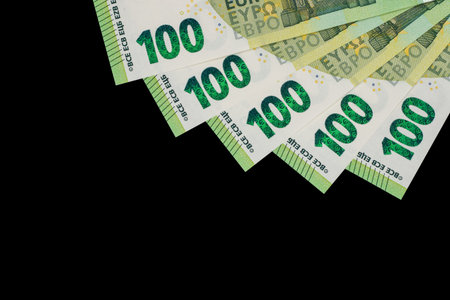 100 euro bills euro banknotes money on dark background. European Union Currency.