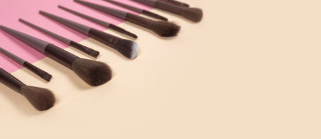 Cosmetic brushes on beige background. Set of makeup brushes.の写真素材