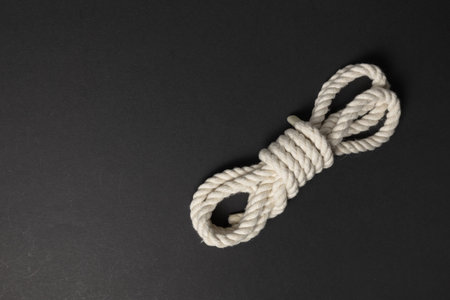beige rope on dark background close up.の写真素材
