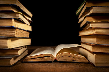 opened book, lying on the bookshelf in library.の写真素材