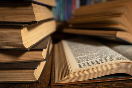 opened book, lying on the bookshelf in library.の写真素材