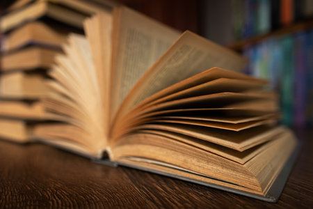 opened book, lying on the bookshelf in library.の写真素材