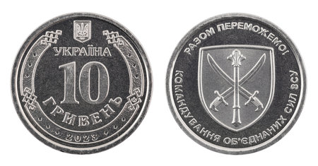 the face and reverse of a 2022 Ukrainian 10 hryvnia coin that has been in circulation and has small scuffs and scratches, close-up on a white backgroundの写真素材
