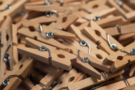 heap wooden clothespins close up. background.の写真素材