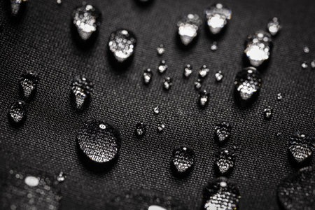 Water drops on waterproof black fabric.の写真素材