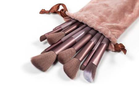 large and small pink cosmetic brushes on white backgroundの写真素材