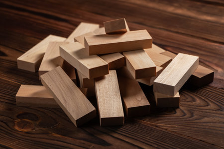 Heap of wooden blocks tower game on wood background.の写真素材