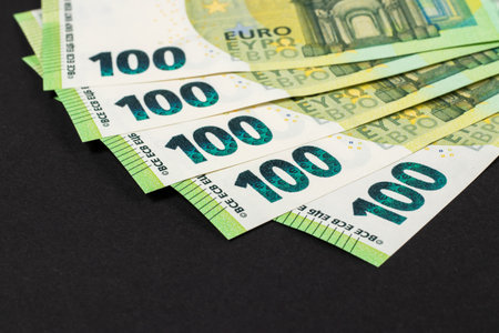 100 euro bills euro banknotes money on dark background. European Union Currency.の写真素材