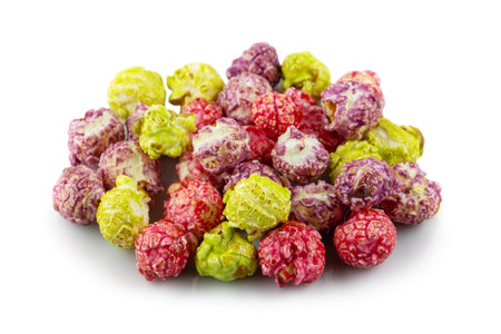 a pile of colorful popcorn on white background.の写真素材
