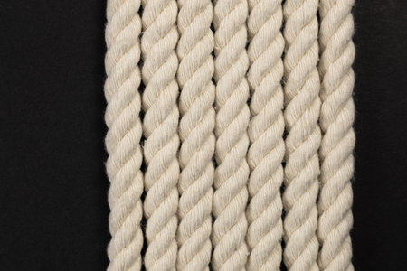 Rope detail on dark. Close-up of its rope texture Depth of field minimalism ropes.