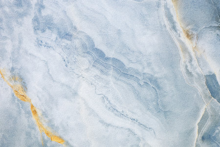 An abstract fluid art painting featuring swirling shades of blue and white, creating a marble-like...