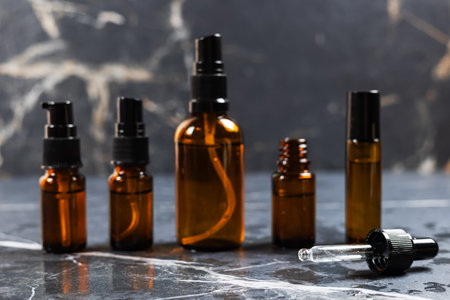 Brown amber glass serum oil dropper bottle on table mock-up, cosmetic container in real interior.の写真素材