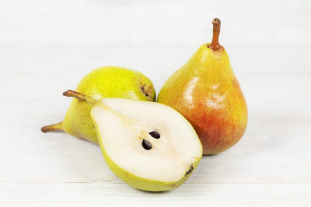 Yellow Pears. Pears on white wooden background. Pears macro studio photo.の写真素材