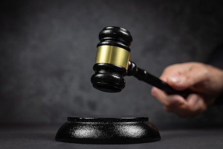 Judge Gavel hitting off a block in courtroom, law and Justice concept.
