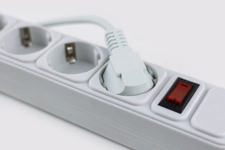 Surge protector with plugs on white background. plug in the network filter on a white background.