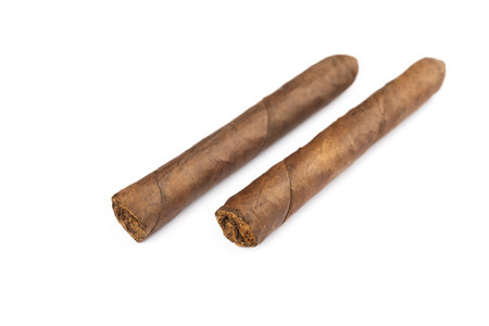 Pair of cigars tobacco torpedo shape isolated on white.