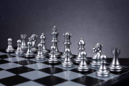 Chess board game in silver team show strategy game as business Challenge competitive game,...