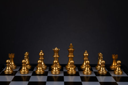The set of golden chess pieces element, king, queen rook, bishop, knight, pawn standing on...