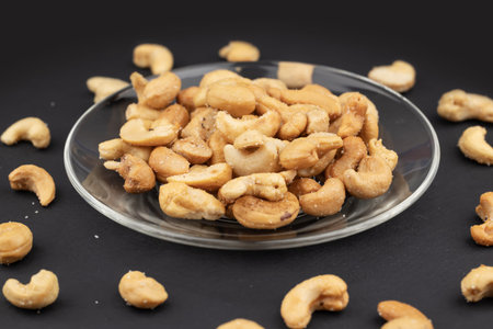 roasted salted cashew nuts on the plate.
