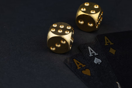 Playing cards and dice. Gambling concept. Dark background.