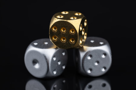 Random number generator. Three dice with numerical values lie in a chaotic order.