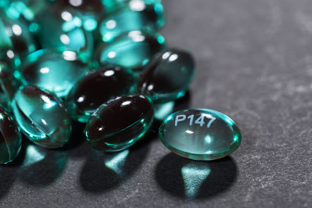 Blue capsules in the shell with liquid vitamin. Blue capsules with a dietary supplement for joints...