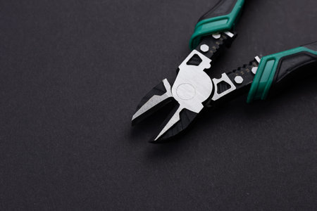 nipper diagonal cutting pliers on dark background.