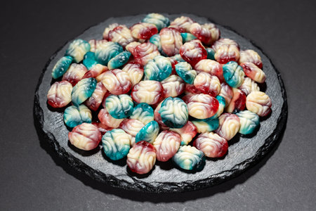 Chewy jelly candy in the form of a brain. Scary sweets for Halloween party.