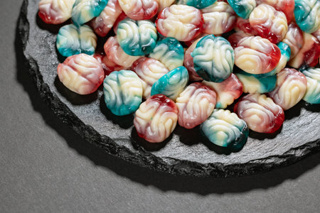 Chewy jelly candy in the form of a brain. Sweets for Halloween party.