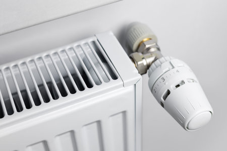 Thermostat on the central heating radiator in the house. Automatic temperature stabilization in the...