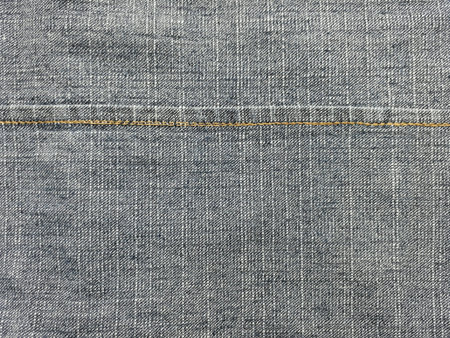 Close up the inside of denimjeans with seam background.の素材