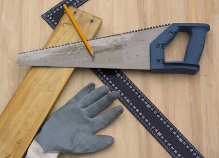 Carpenter at work, makes crafts from boards and plywoodの写真素材