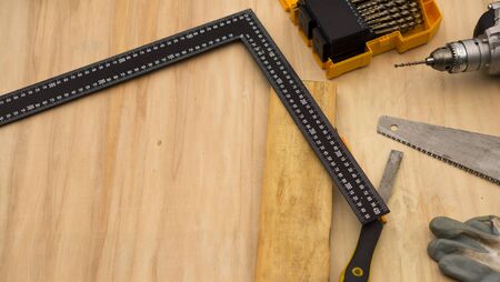 Carpenter at work, makes crafts from boards and plywoodの写真素材