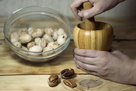 Pecans and making walnut pasteの写真素材