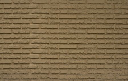 Brick wall texture. Yellow decorative brick.の写真素材