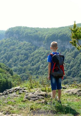 Boy traveling the wild mountains of the North Caucasusの写真素材