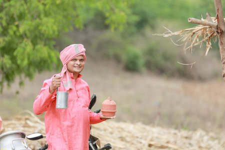 Indian farmer selling milk on bikeの写真素材