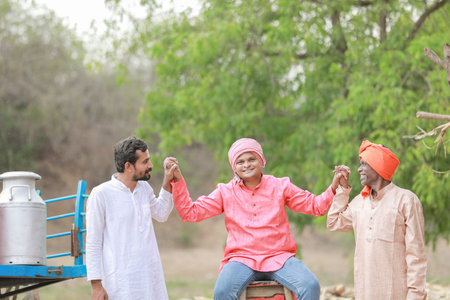 Group of three asian male farmer smile and thumb up standing in farm, close friendsの写真素材