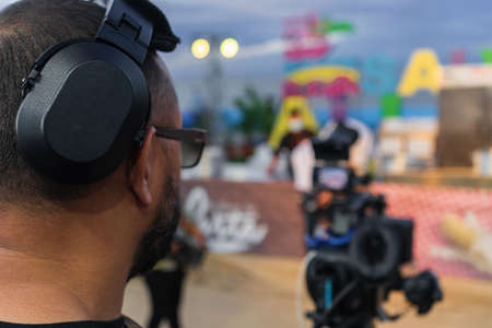 A cameraman makes footage and broadcasts a cooking show on tvの写真素材