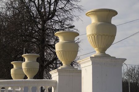 Large decorative pots on the railing of the bridgeの写真素材