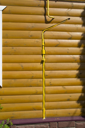 pipeline laid in the wall of the wooden houseの写真素材