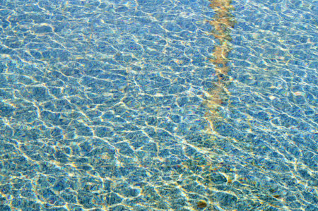background of rippled pattern of clean water in a swimming pool