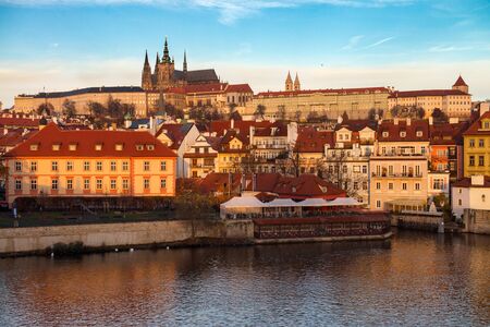 Prague, Czech Republic - November 20, 2016. Prague Castle (Hradcany) in the autumn warm morning rays with beautiful orange colours.のeditorial素材